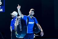 Novak Djokovic waves to the crowd after his 2025 Australian Open retirement. (Source: Getty)